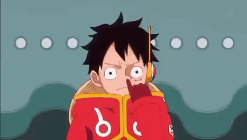 Luffy From One Piece Is Reading A Book While Holding A Stick In His Mouth . GIF