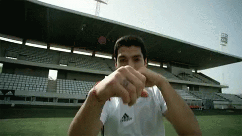 Luis Suarez Punching Camera GIF