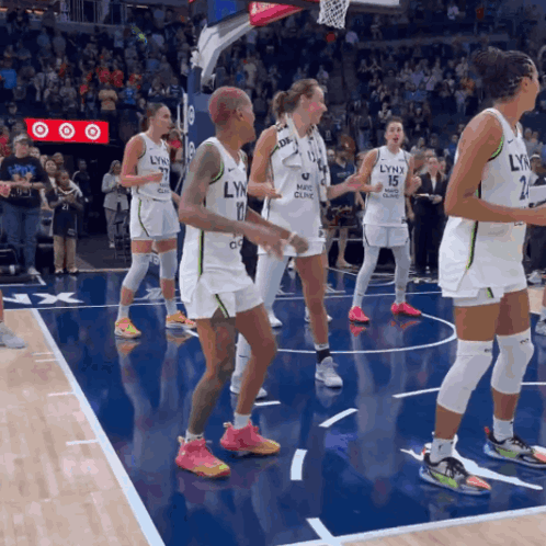 Lynx Basketball Players Are Dancing On The Court GIF