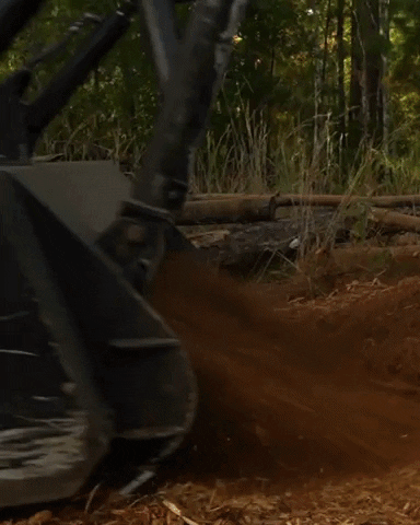 Machine Ejecting Mulch Slow Motion GIF