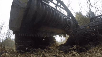 Machine Generating Mulch Close Shot GIF
