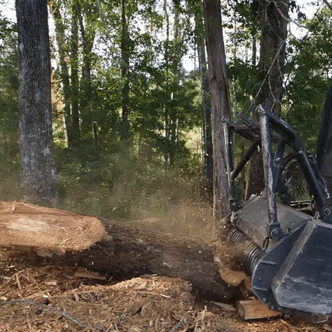 Machine Generating Mulch From Wood GIF