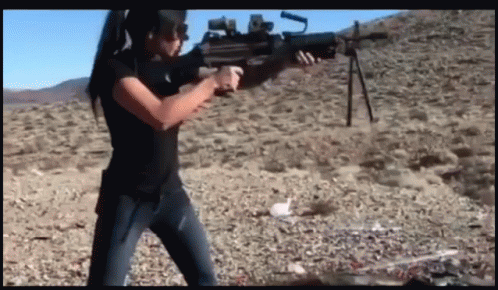 Woman Firing A Machine Gun GIF
