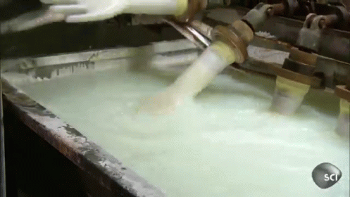 Machine Pouring Liquid Into Sci Container
