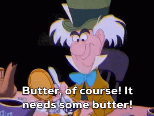 Mad Hatter From Alice In Wonderland Is Sitting At A Table With A Can Of Butter . GIF