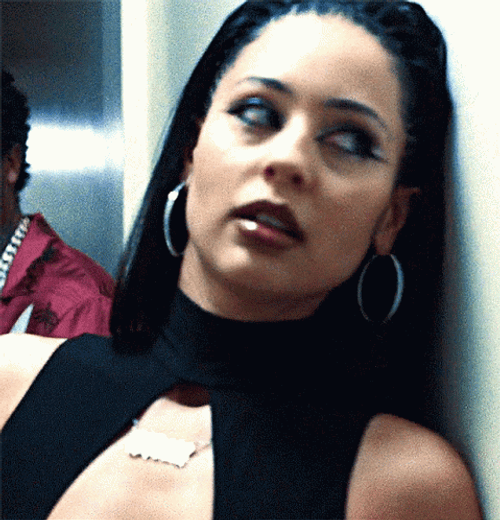 Maddy Perez Drowsy Leaning On Wall GIF