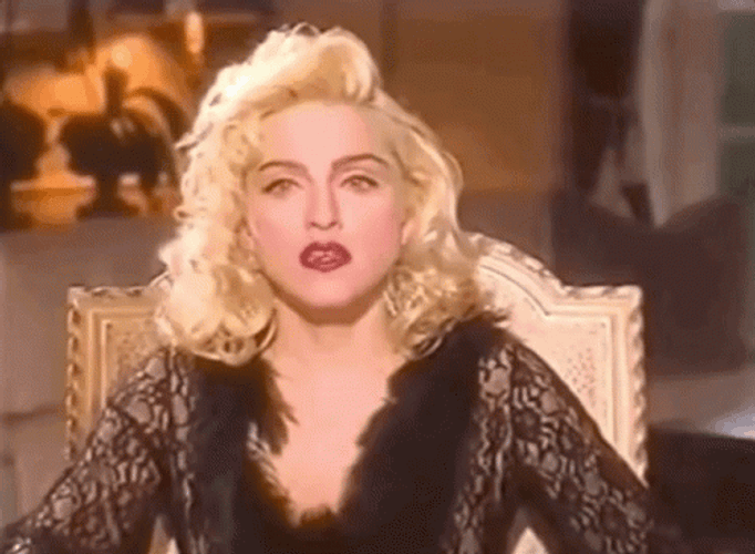 Madonna hands up gif.
