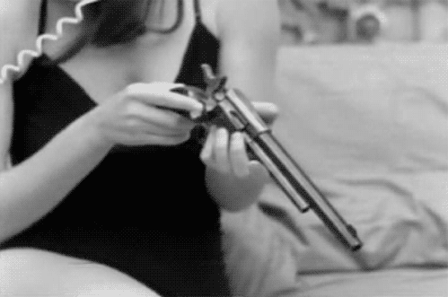 Mafia Girl Fixing Her Gun GIF
