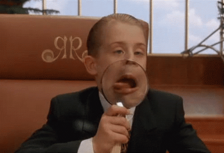 Magnifying Glass Home Alone McCaulley Tongue Out GIF