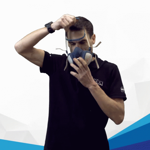 Man Adjusted Strap Of Gas Mask GIF