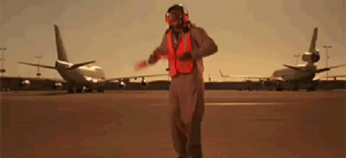 Man Airport Marshal Dancing In Runway GIF
