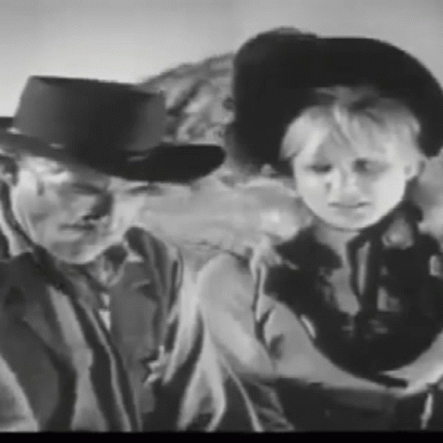 Man and Boy in Cowboy Hats
