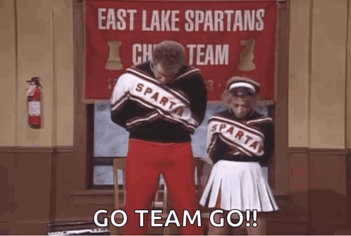 Man and Cheerleaders East Lake Spartans