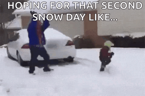 Man and Child Playing in Snow