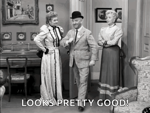 Man and Two Women in Living Room Looks Pretty Good