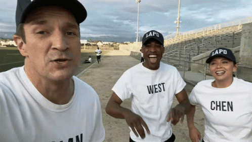 Man And Two Women In White T-Shirts Saying West GIF