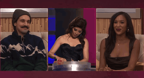 Man and Two Women on Couch Open-Mouthed