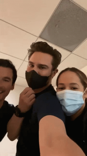 Man And Two Women Wearing Face Masks Posing GIF