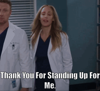Man And Woman Applauding Before Crowd GIF