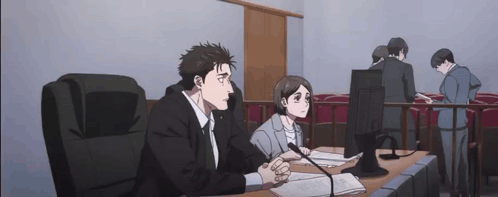 Man and Woman at Table in Courtroom