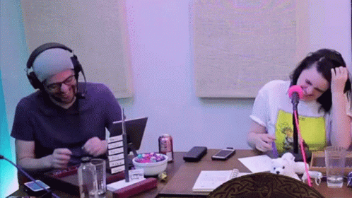 Man and Woman at Table with Microphone and Candy