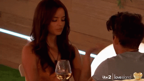 Man and Woman at Table with Wine