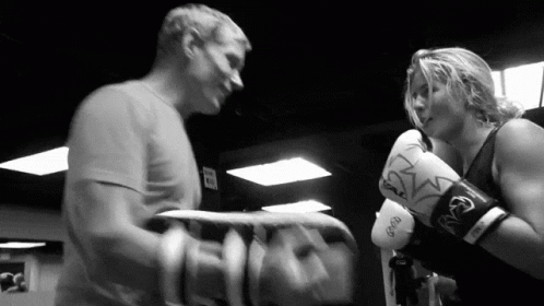 Man and Woman Boxing in Gym with Everlast Gloves