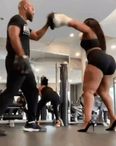 Man And Woman Boxing, Woman In High Heels GIF
