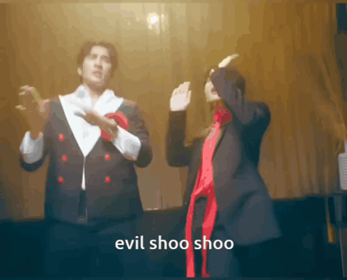 Man and Woman Dancing Evil Shoo Shoo