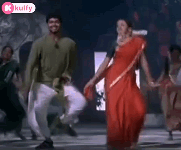 Man And Woman Dancing Hand In Hand GIF