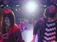 Man and Woman Dancing in Crowd