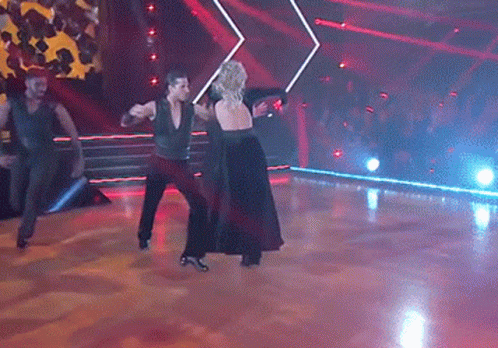 Man and Woman Dancing in Dark Room