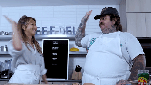 Man and Woman Dancing in Front of Beef Deli Sign