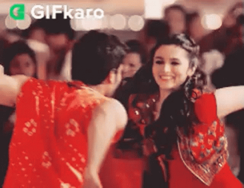Man And Woman Dancing In Front Of Crowd GIF