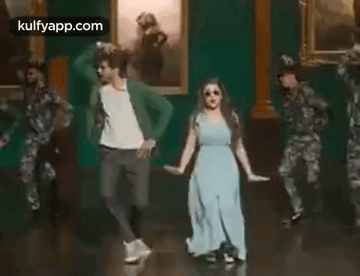 Man and Woman Dancing in Front of Soldiers