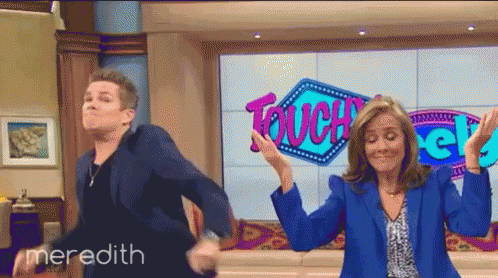 Man And Woman Dancing In Front Of Touch Sign GIF