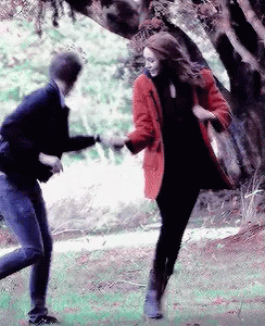 Man and Woman Dancing in Park