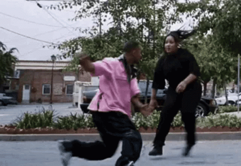Man And Woman Dancing In Parking Lot GIF