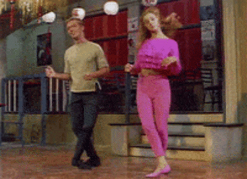 Man And Woman Dancing In Pink Pants GIF