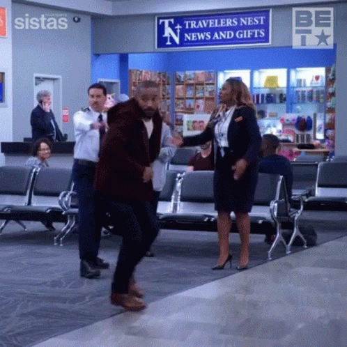 Man And Woman Dancing In Waiting Room GIF