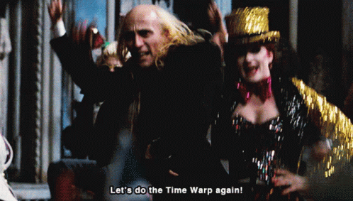 Man and Woman Dancing Let's Do the Time Warp Again