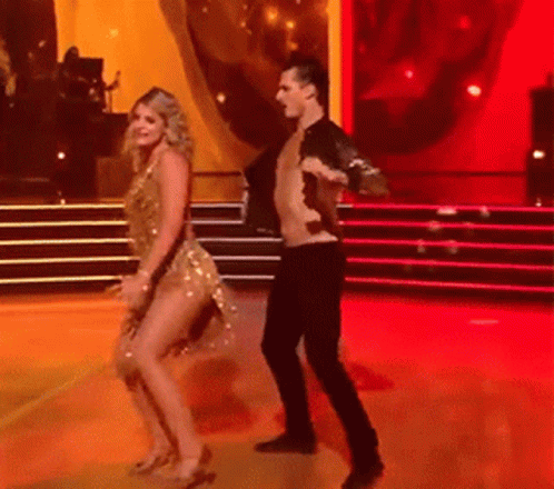 Man and Woman Dancing on Red Carpet