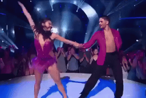 Man and Woman Dancing on Stage