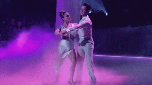 Man and Woman Dancing on Stage