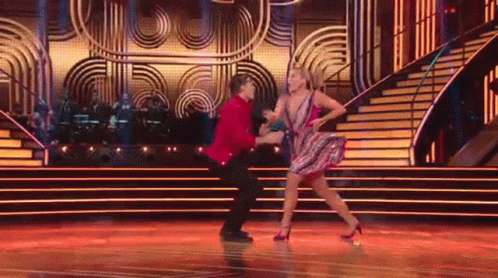 Man and Woman Dancing on Stage