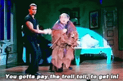 Man And Woman Dancing On Stage Saying You Gotta Pay The Troll Toll GIF