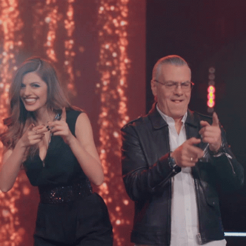 Man and Woman Dancing on Stage Smiling