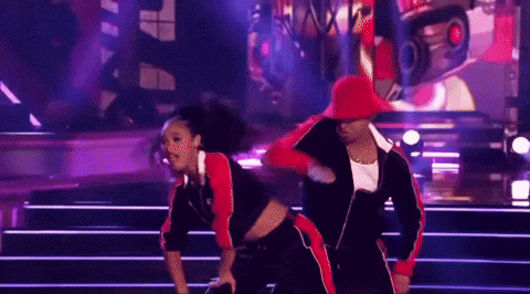 Man and Woman Dancing on Stage, Woman in Red Hat