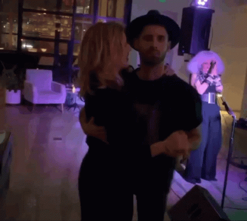 Man and Woman Dancing on Stage, Woman Singing