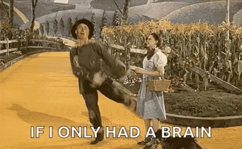 Man And Woman Dancing On Yellow Brick Road GIF